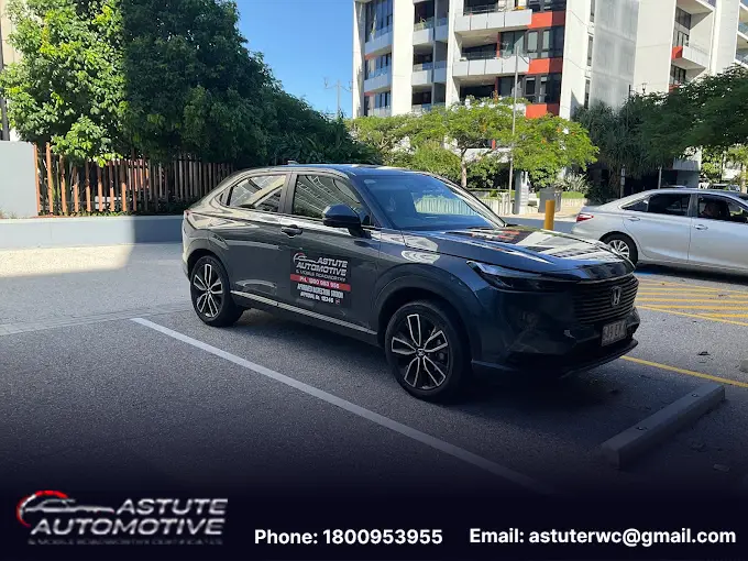 An Astute Automotive inspector carrying out a mobile roadworthy inspection at a customer address in Aspley.