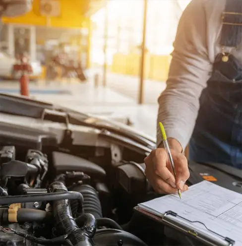 An Astute Automotive inspector carrying out a mobile roadworthy inspection at a customer address in Lawnton.
