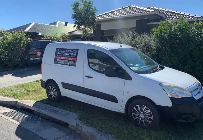 An Astute Automotive inspector carrying out a mobile roadworthy inspection at a customer address in Warner.
